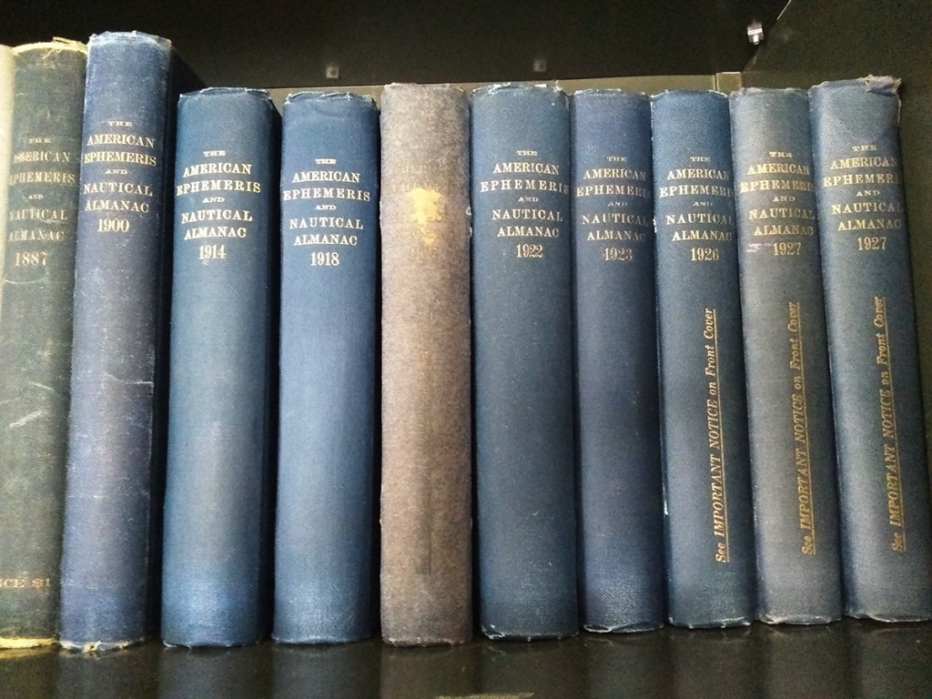 Ephemeris books on shelf