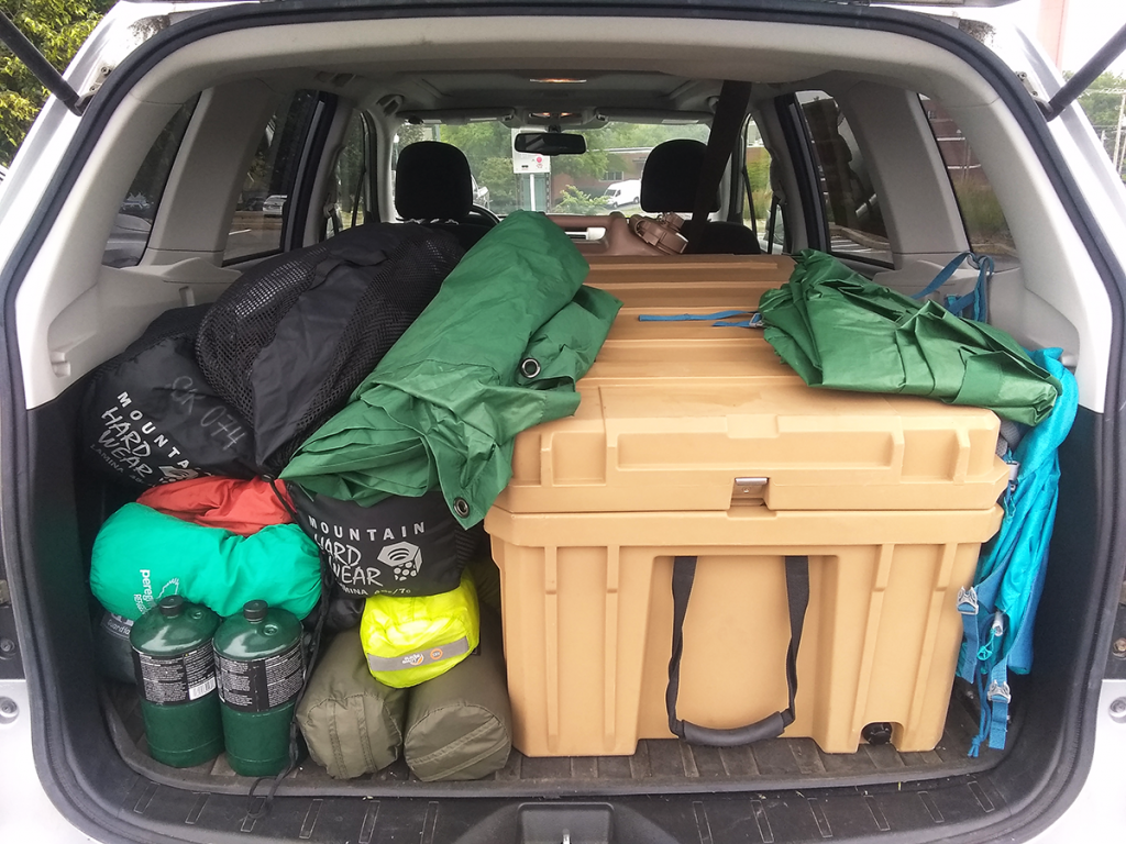 Trunk packed with camping gear.