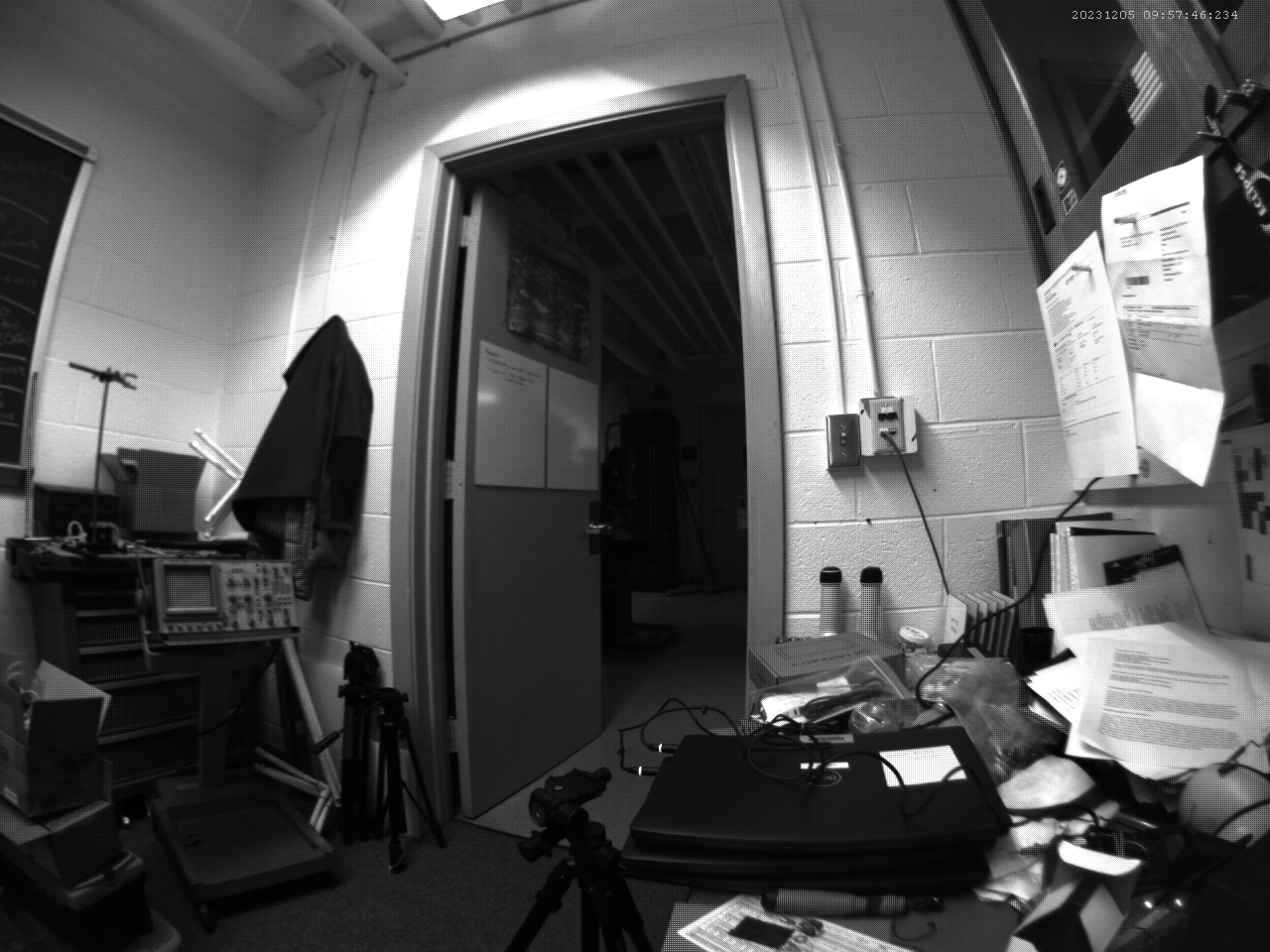 Black and white image of a messy office.