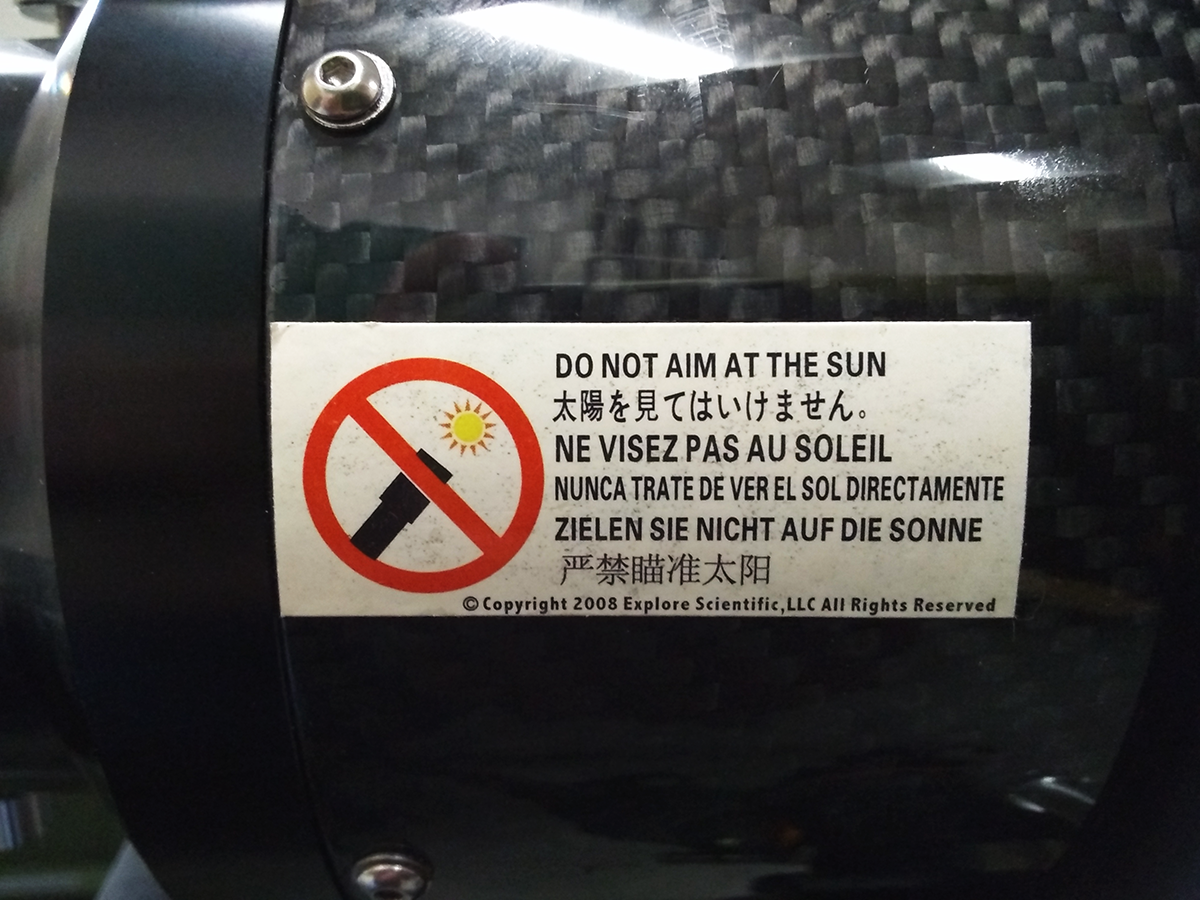 Telescope label reading "Do Not Aim At The Sun"