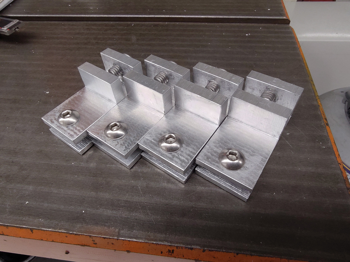 Machined aluminum brackets with screws