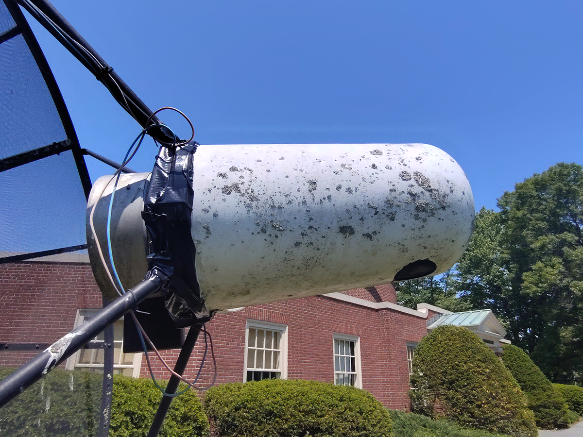 Radio telescope with restored nose cone, gaps sealed with duct tape.