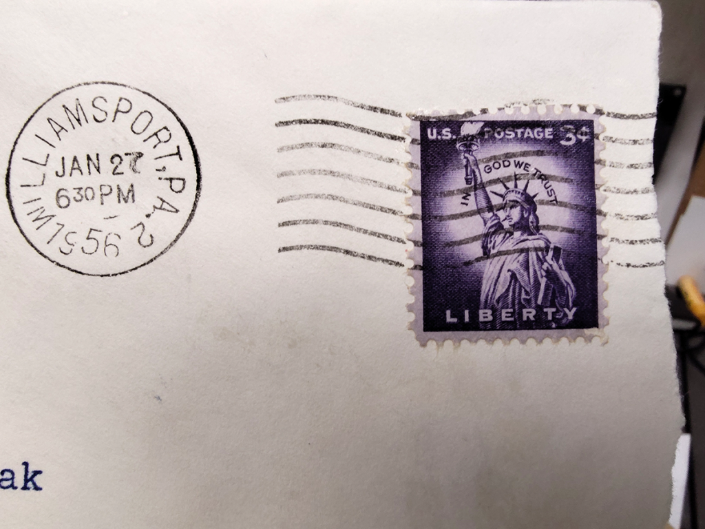 3-cent postage stamp on an old envelope.