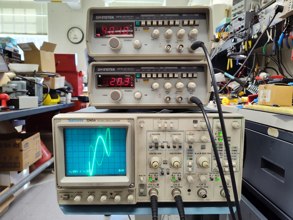 Analog oscilloscope and function generators producing lissajous figures.