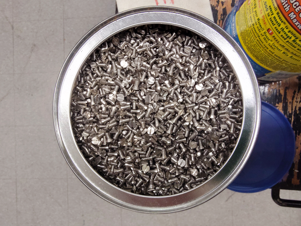 Coffee can full of tiny screws.