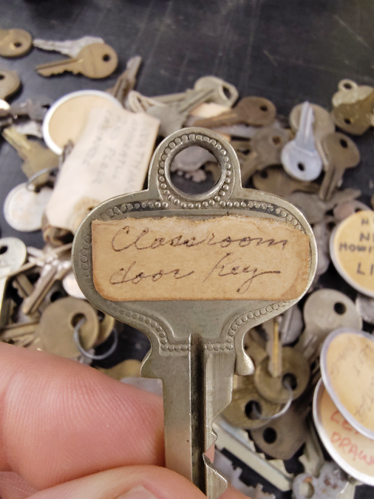 Key with handwritten label: Classroom door key