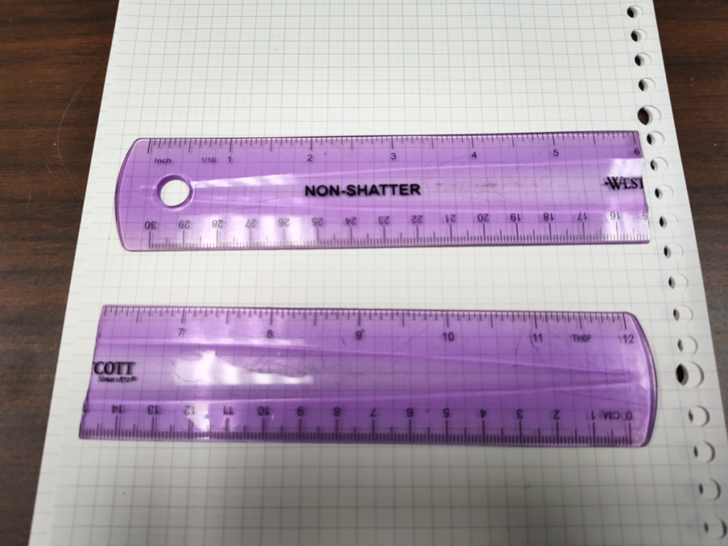 Broken plastic ruler, reading "Non-Shatter"