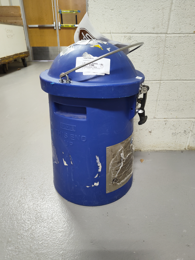 Locked, lidded transport container in delightful blue.