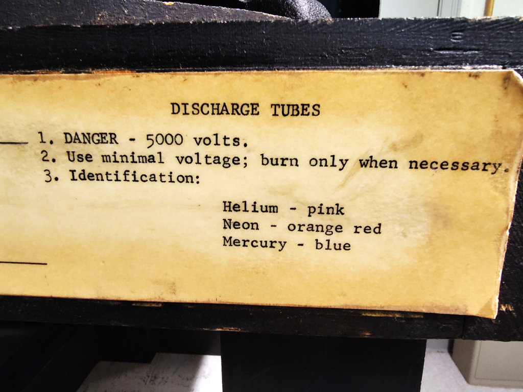 Typed signage for old gas dischareg tubes.