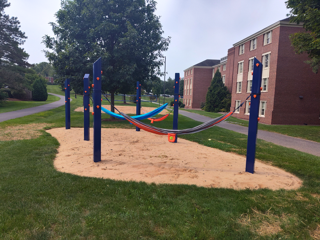 Hammocks strung up among permanent, blue-and-orange, bison-bedecked posts.